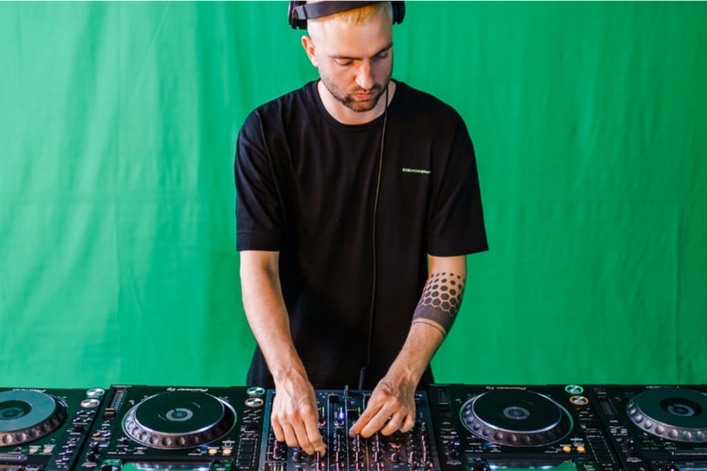Many DJs use a green screen when live streaming to create custom visual experiences